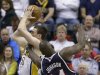 Indiana Pacers' Tyler Hansbrough, left, goes to the basket against Atlanta Hawks' Ivan Johnson during the first half of Game 1 in the first round of the NBA basketball playoffs on Sunday, April 21, 2013, in Indianapolis. (AP Photo/Darron Cummings)