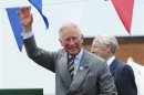Britain's Prince Charles waves to the crowd during a visit to the harbour in Bridlington