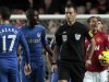 In this Sunday, Oct. 28, 2012 photo, Chelsea's Ramires, center left, remonstrates with referee Mark Clattenburg, center right, during their English Premier League soccer match against Manchester United at Stamford Bridge, London. Chelsea accused referee Mark Clattenburg of using "inappropriate language" at two players during Sunday's Premier League match against Manchester United, and lodged an official complaint with the Football Association. Clattenburg sent off two Chelsea players in the 3-2 loss to United at Stamford Bridge and allowed a contentious late winning goal to striker Javier Hernandez, who appeared to be offside when he scored. (AP Photo/Sang Tan)