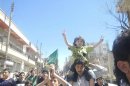 Demonstrators protest against Syria's President Bashar Al-Assad in Kafranbel, near Idlib