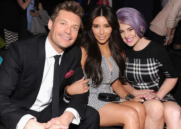 Kim Kardashian cosied up to Ryan Seacrest and Kelly Oscbourne at the basg 