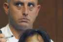 Annie Dookhan, 34, of Franklin, Mass., stands near a court officer during her arraignment Friday, Sept. 28, 2012, in Boston Municipal Court on two counts of obstruction of justice and pretending to hold a degree for a college or university. Dookhan's alleged mishandling of drug samples prompted the shutdown of a state drug lab in Boston in August and resulted in the resignation of three officials, including the state's public health commissioner. (AP Photo/Boston Herald, Patrick Whittemore, Pool)