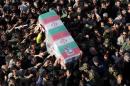 Iranian mourners carry the coffin of General Mohammad Ali Allahdadi -- a commander of the Islamic republic's Revolutionary Guards who was killed in an Israeli air strike on Syria -- during his funeral procession in Tehran, on January 21, 2015