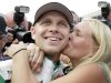 Ed Carpenter gets a kiss from his wife, Heather, after he won won the pole for the Indianapolis 500 auto race, at Indianapolis Motor Speedway in Indianapolis, Saturday, May 18, 2013. Carpenter won the pole with a speed of 228.762 mph. (AP Photo/AJ Mast)