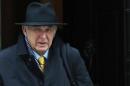 Britain's Business Secretary Vince Cable leaves Downing Street in London