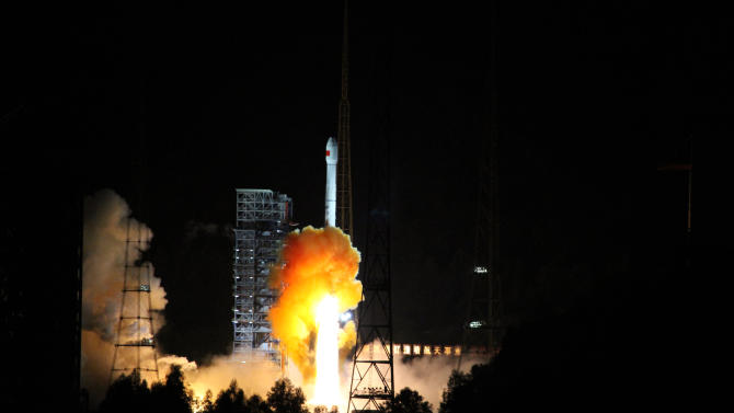 A rocket carrying an experimental spacecraft intended for the moon and back launches from Xichang space base in China&#39;s Sichuan province on October 24, 2014