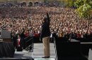 U.S. President Barack Obama waves to an estimated crowd of 30,000 at a campaign rally at the University of Wisconsin in Madison