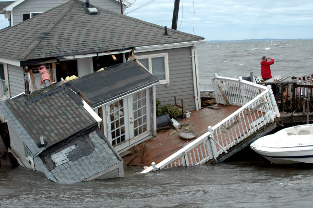 A Fairfield Beach Road home is submerged in Pine Creek in Fairfield, Conn. as treacherous weather caused by Tropical Storm Irene came through the area on Sunday Aug. 28, 2011. Tropical Storm Irene sen