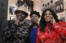This March 12, 2013 photo show The Andantes, from left, Jackie Hicks, Marlene Barrow-Tate and Louvain Demps posing during a visit to Motown Historical Museum in Detroit. In their 70s, the unsung backing group who sang on thousands of Motown songs is finally getting acclaim for its contributions to the ground-breaking, chart-topping music made in Detroit in the 1960s and early '70s before the label moved to Los Angeles. The trio gathered recently to see the exhibit, “Motown Girl Groups: The Grit, the Glamour, the Glory.” The Andantes are featured, with equal billing, alongside the Supremes, Vandellas, Marvelettes and Velvelettes. (AP Photo/Paul Sancya)