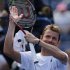 Mardy Fish celebrates after beating Tobias Kamke of germany 6-2, 6-2, 6-1, during the first round of the U.S. Open tennis tournament in New York, Monday, Aug. 29, 2011. (AP Photo/Mike Groll)