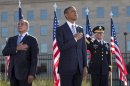 President Barack Obama, flanked by Defense Defense Leon Panetta, left, and Joint Chiefs Chairman Gen. Martin Dempsey, place their hands over their hearts at the Pentagon Memorial,Tuesday, Sept. 11, 2012, during a ceremony to mark the 11th anniversary of the Sept. 11 attacks. (AP Photo/Carolyn Kaster)