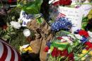 Items left at a memorial at the Armed Forces Career Center are seen in Chattanooga, Tennessee