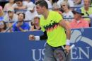Milos Raonic of Canada reacts after defeating Victor Estrella Burgos of the Dominican Republic during their match at the 2014 U.S. Open tennis tournament in New York