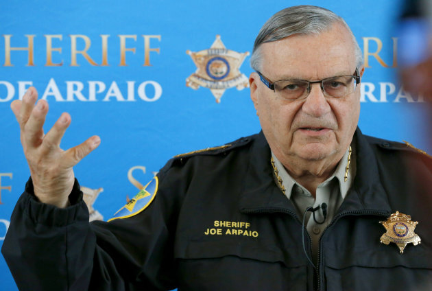 FILE - In this Dec. 18, 2013 file photo, Maricopa County Sheriff Joe Arpaio announces dozens of arrests in a prostitution sting during a news conference at Maricopa County Sheriff's Office Headquarters, in Phoenix. Arpaio and his top aide Chief Deputy Jerry Sheridan are required to appear before a federal judge who believes the two have mischaracterized and trivialized the judge's key findings in a racial-profiling decision issued in 2013 against the police agency. The sheriff's office will be required to provide answers Monday, March 24, 2014 to U.S. District Judge Murray Snow about an Oct. 18 training session in which the judge said Sheridan appears to suggest that rank-and-file deputies weren't obliged to make their best efforts to remedy the agency's constitutional violations. (AP Photo/Ross D. Franklin, File)