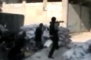 This image made from amateur video released by the Ugarit News and accessed Sunday, July 15, 2012, purports to show Free Syrian Army soldiers clashing with Syrian government forces in Damascus, Syria. Syrian troops and rebels clashed inside Damascus for a second day on Monday, causing plumes of black smoke to drift over the city's skyline in some of the worst violence in the tightly controlled capital since the country's crisis began 16 months ago. (AP Photo/Ugarit News via AP video) TV OUT, THE ASSOCIATED PRESS CANNOT INDEPENDENTLY VERIFY THE CONTENT, DATE, LOCATION OR AUTHENTICITY OF THIS MATERIAL