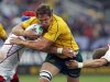 Russia's Artem Fatakhov and Andrey Kuzin tackle Australia Wallabies' Scott Higginbotham during their Rugby World Cup Pool C match at Trafalgar Park in Nelson