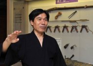 Jinichi Kawakami at the Iga Ninja Museum on June 29. A 63-year-old former engineer may not fit the typical image of a dark-clad assassin with deadly weapons who can disappear into a cloud of smoke -- but Jinichi Kawakami is reputedly Japan's last ninja. (AFP Photo/Kazuhiro Nogi)