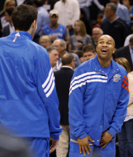 Oklahoma City Thunder guard Derek Fisher, right, talks with new teammate Nick Collison, left, before an NBA basketball game against the Los Angeles Clippers in Oklahoma City, Wednesday, March 21, 2012. (AP Photo/Sue Ogrocki)