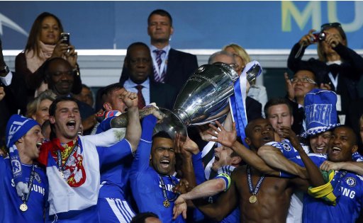 Chelsea's players celebrate with the trophy after their Champions League final soccer match against Bayern Munich at the Allianz Arena in Munich