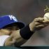 Kansas City Royals' Brayan Pena holds a baseball with a mantodea ,more commonly known as a  praying mantises, on it during the eighth inning of a baseball game against  the Detroit Tigers  in Detroit, Monday, Aug. 29, 2011. (AP Photo/Paul Sancya)