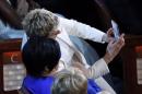 Host DeGeneres takes a "selfie" photo with actress and singer Minnelli at the 86th Academy Awards in Hollywood