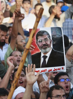 One of the supporters of Egypt's ousted President Mohammed …
