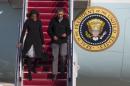 President Barack Obama and first lady Michelle Obama step off Air Force One after arriving at Andrews Air Force Base after spending the weekend in Key Largo, Fla., on Sunday, March 9, 2014, in Andrews Air Force Base, Md. (AP Photo/ Evan Vucci)