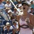 Sharapova of Russia celebrates a point against Azarenka of Belarus during their women's semifinals match at the U.S. Open tennis tournament in New York