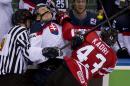 Canada's Nazem Kadri hits Slovakia's Marek Daloga with a high stick during second period action at the IIHF Ice Hockey World Championship in Minsk, Belarus, on Saturday, May 10, 2014. (AP Photo/The Canadian Press, Jacques Boissinot)