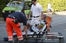 Australian cyclist Stuart O?Grady lies on a stretcher after he crashed during the 245.9km Vattenfall Cyclassics in Hamburg