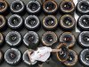 McLaren mechanic arranges Pirellis tyres in the paddock ahead of the Spanish F1 Grand Prix in Montmelo