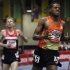 Gebrhiwet crosses finish line ahead of Rupp during men's 3000 meters at the New Balance Indoor Grand Prix track meet in Boston