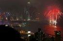 Fireworks explode over the Victoria Harbour to celebrate the Chinese Lunar New Year in Hong Kong Monday, Feb. 11, 2013. (AP Photo/Vincent Yu)