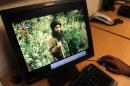A Pakistani journalist watches a video of radical Pakistani cleric Maulana Fazlullah in Peshawar on July 23, 2010