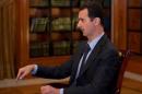 Syria's President Bashar al-Assad speaks during an interview with al-Mayadin television station,in Damascus