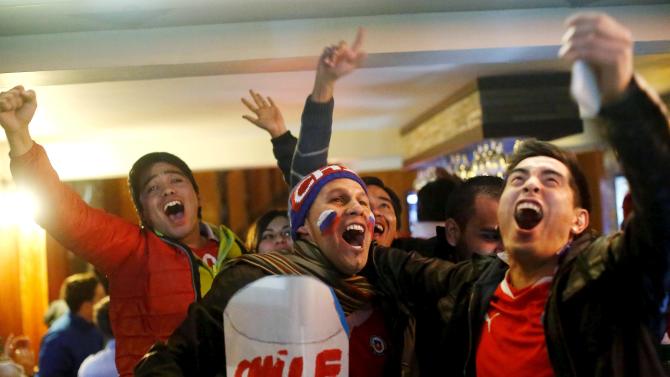 Fans celebrate Chile&#39;s victory over Peru in their Copa America semi-final soccer match in Santiago, Chile