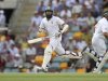 South Africa's Amla and Kallis complete a run as Australia's Ponting looks on, during the first cricket test match at the Gabba in Brisbane