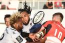 Owen Farrell (right) takes on RC Toulon's Mathieu Bastareaud (left) and Ma'a Nonu (C) at the Mayol stadium in Toulon on October 15, 2016