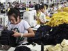 In this photo taken on Monday, July 11, 2011,  female employees work in a factory making bamboo-fabric clothes in Zouping county in east China's Shandong province. China's manufacturing slowed further in July as Beijing cooled an overheated economy and demand for exports weakened amid Europe's debt crisis and sluggish U.S. growth, two surveys showed Monday. (AP Photo) CHINA OUT