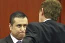 George Zimmerman chats with his defense attorney Mark O'Mara during an early morning recess in his secondnd-degree murder trial in the fatal shooting of Trayvon Martin in Seminole circuit court in Sanford