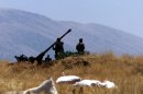 FILE -- In this July 1, 2001 file photo, Syrian soldiers prepare an anti-aircraft gun near field of wheat close to a radar position in eastern Lebanon's Bekaa valley. Any international military action against Syria's regime over its reported use of chemical weapons would run up against one of the Middle East's most formidable air defenses. Syrian leader Bashar Assad has modernized the system since 2007, going on a buying spree for new Russian missiles to complement thousands of anti-aircraft guns to give multi-layer protection to strategic locations _ likely a key consideration as President Barack Obama weighs the options. (AP Photo, File)