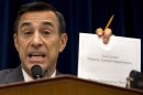 House Oversight Committee Chairman Rep. Darrell Issa, R-Calif. holds up a document as he speaks to IRS official Lois Lerner on Capitol Hill in Washington, Wednesday, May 22, 2013, during the committee's hearing to investigate the extra scrutiny IRS gave to Tea Party and other conservative groups that applied for tax-exempt status. Lerner told the committee she did nothing wrong and then invoked her constitutional right to not answer lawmakers' questions. (AP Photo/Carolyn Kaster)