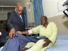 South Africa's President Jacob Zuma chats with one of the injured miners during a courtesy visit in a hospital outside a South African mine in Rustenburg