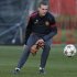 Manchester United's Vidic stretches for a ball during a training session at the club's Carrington training complex in Manchester