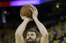 Cleveland Cavaliers forward Kevin Love warms up before Game 5 of basketball's NBA Finals between the Golden State Warriors and the Cavaliers in Oakland, Calif., Monday, June 13, 2016. (AP Photo/Marcio Jose Sanchez)