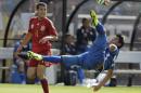 El Salvador's Alexander Larin (13) makes on overhead kick as Spain's Pedro Rodriguez (11) defends during the first half of an exhibition soccer game, Saturday, June 7, 2014, in Landover, Md. (AP Photo/Luis M. Alvarez)