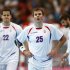 Serbia's Bojan Beljanski and Dalibor Cutura react after their loss to Hungary in their men's handball Preliminaries Group B match at the Copper Box venue during the London 2012 Olympic Games