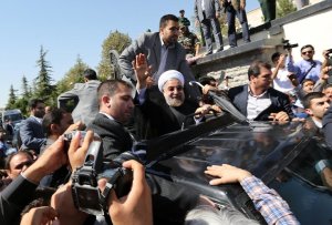 Iranian president Hassan Rouhani waves to supporters …