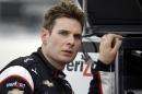 Will Power, of Australia, talks to crew members after practice for the IndyCar Firestone Grand Prix of St. Petersburg auto race Friday, March 27, 2015, in St. Petersburg, Fla. The race takes place on Sunday. (AP Photo/Chris O'Meara)