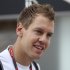 Red Bull driver Sebastian Vettel of Germany arrives at the paddock on the Marina Bay City Circuit for Sunday's Singapore Formula One Grand Prix in Singapore, Thursday, Sept. 22, 2011. (AP Photo/Terence Tan)